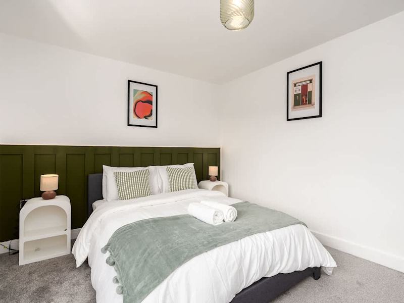A double bedroom made up with fresh linen and towels