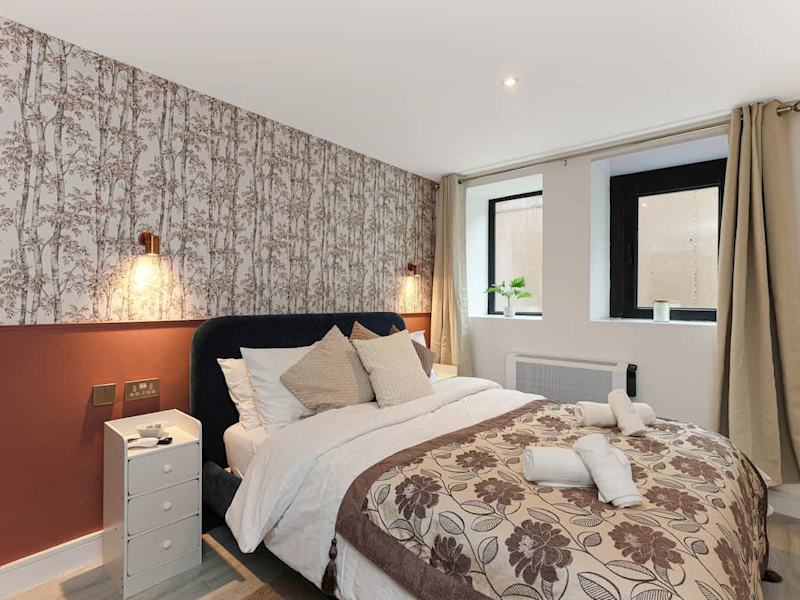 A double bedroom made up with fresh linen