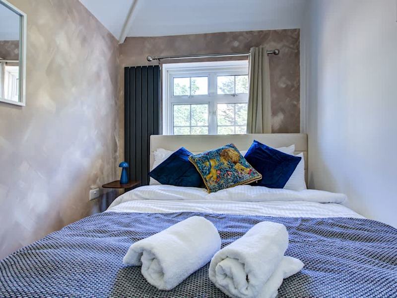 A double bedroom made up with fresh linen