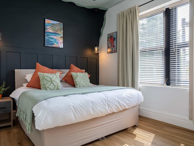 A double bedroom made up with fresh linen