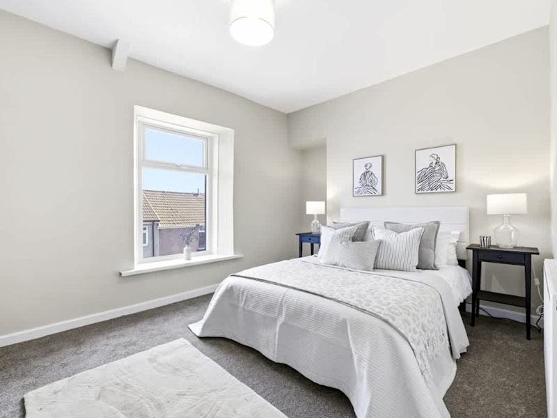A double bedroom made up with fresh linen