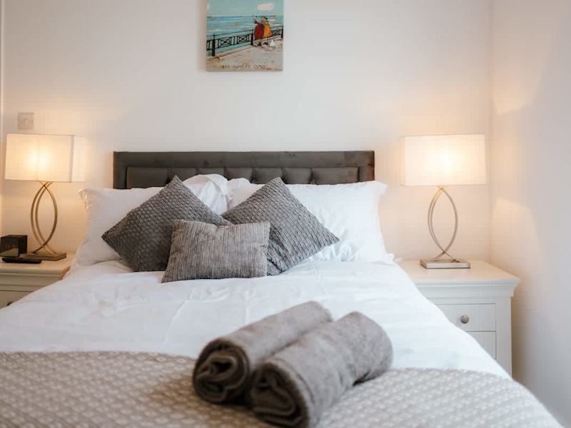 A double bedroom made up with fresh linen