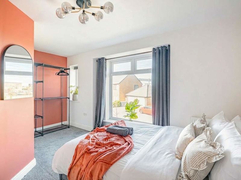 A bedroom made up with fresh linen