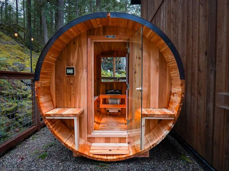 Melt away the day in the brand new barrel sauna with views of the trees. 
