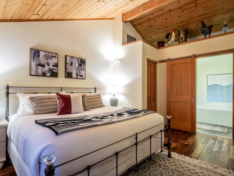 Master bedroom on the third floor of the home, complete with a comfy king bed and full ensuite. 