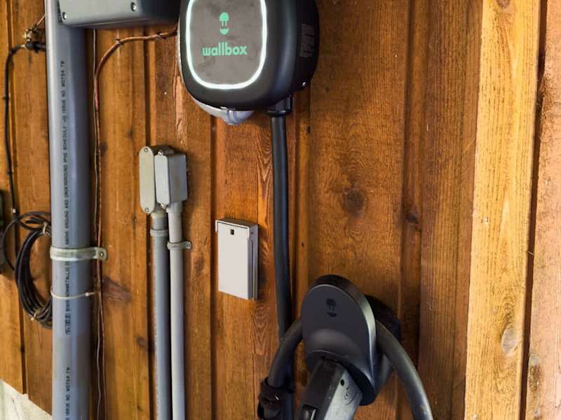 WallBox EV Car Charger. On the side of the house, under the car port.
