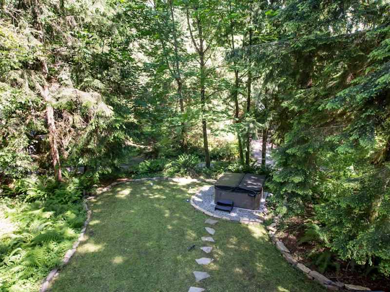 View of front yard and hot tub from upper balcony