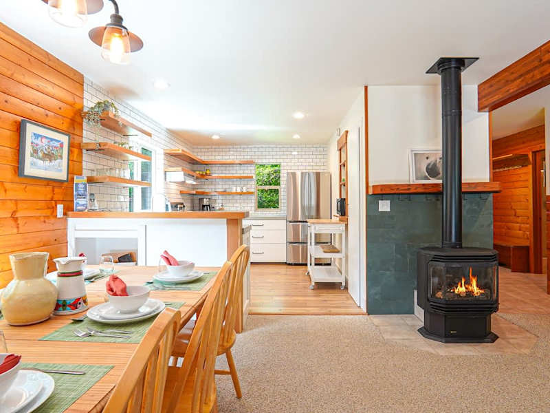 Cozy fireplace centrally located in the living room and dining room. 