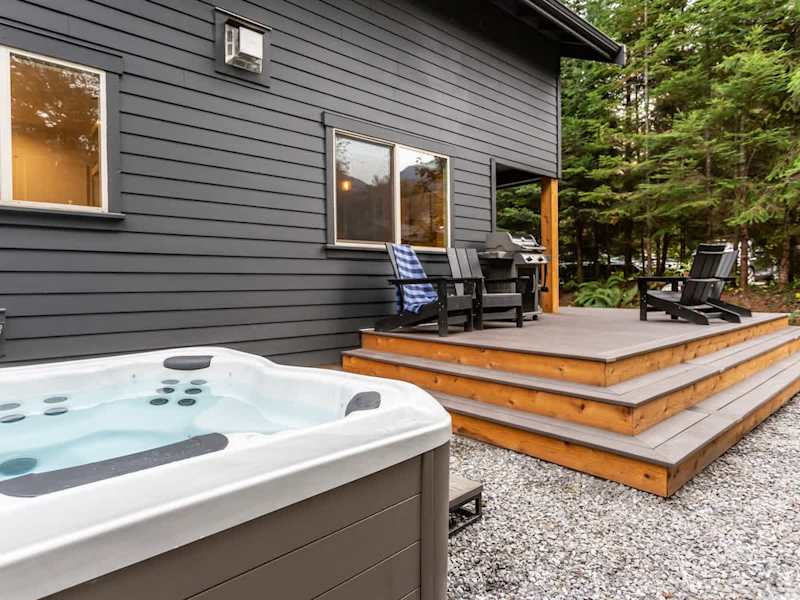 8 person hot tub conveniently located off the back deck. 