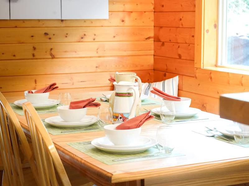 Cozy dining room with cozy booth style seating. 