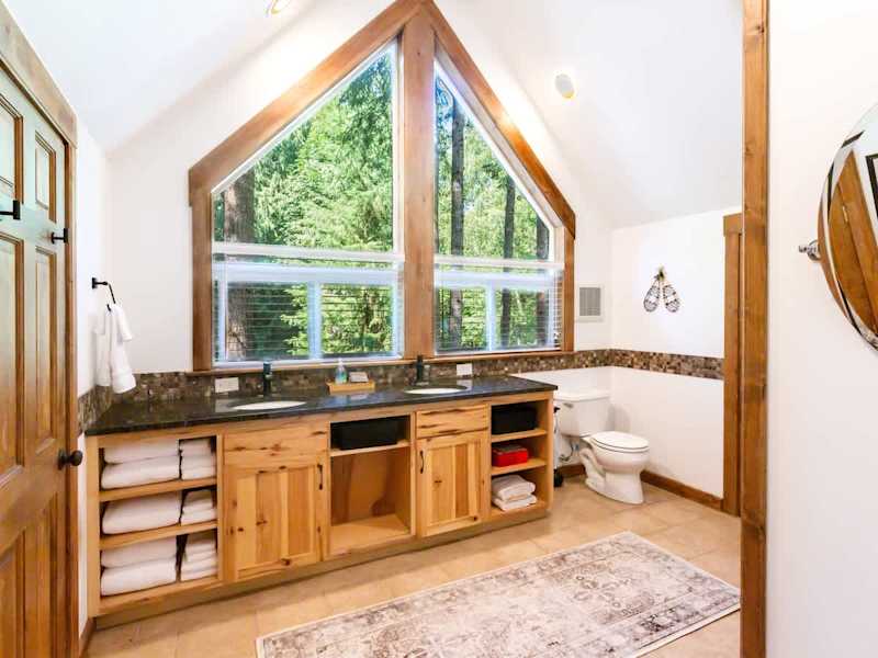 Enjoy getting ready with a view of the trees surrounding the home. 