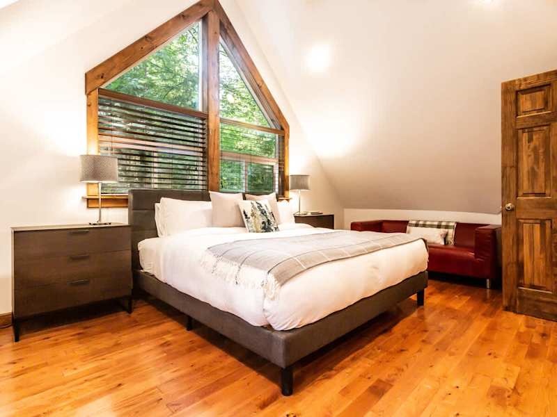 Enjoy a cup of coffee or glass of wine on the couch in the dedicated lounge area in the master bedroom. 