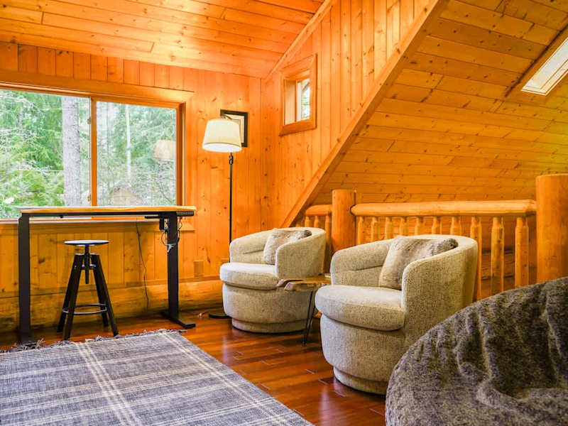 Enjoy cozy movie nights on the massive lovesac or work on our standing desk with a view of the trees. 