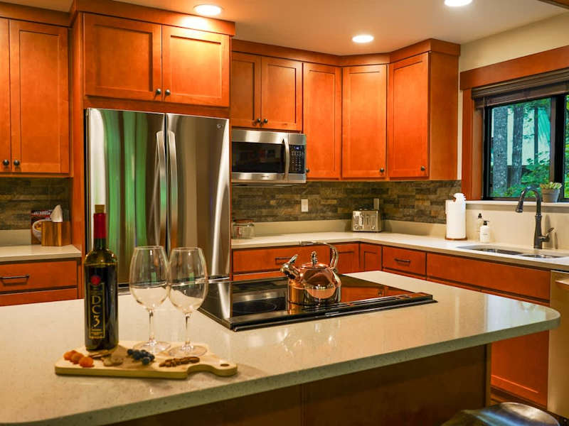 View of the kitchen looking over the island.