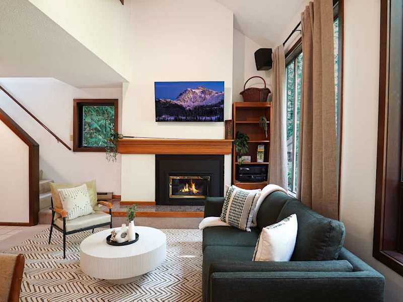 Living room with TV and fireplace