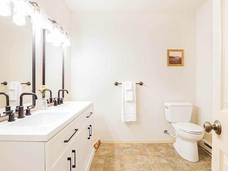 Primary bathroom with double vanity and shower 
