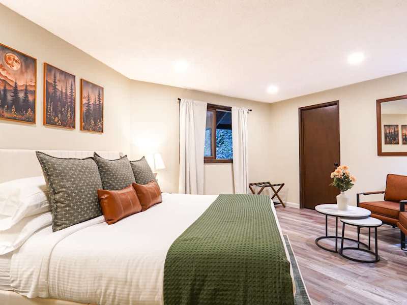 Upstairs bedroom with Helix king sized bed and cozy seating area. 