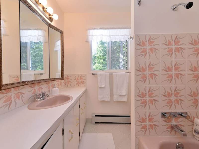 Second floor bathroom with tub.