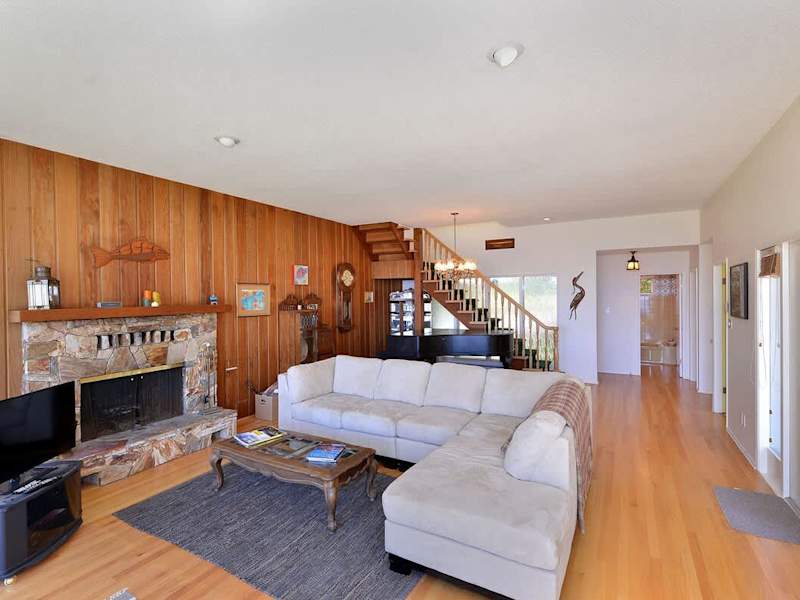 Well appointed living room with incredible views and a grand piano.