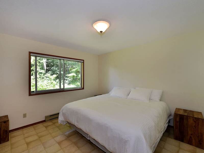 Bedroom in the attached suite with rainforest view.