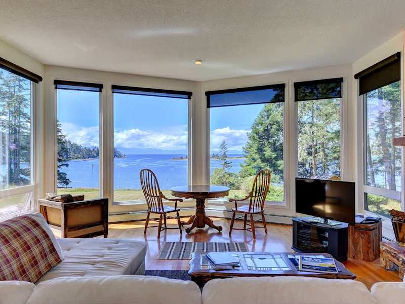 Well appointed living room with incredible views and a grand piano.