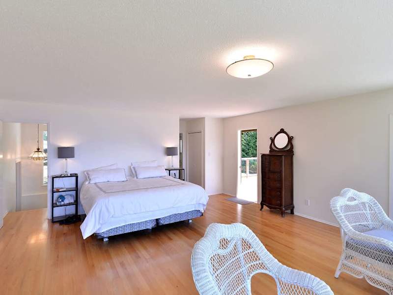 Master bedroom with wide ocean views and deck access.