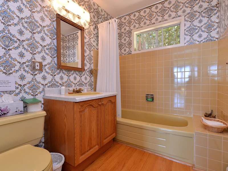 Ground level bathroom with tub.