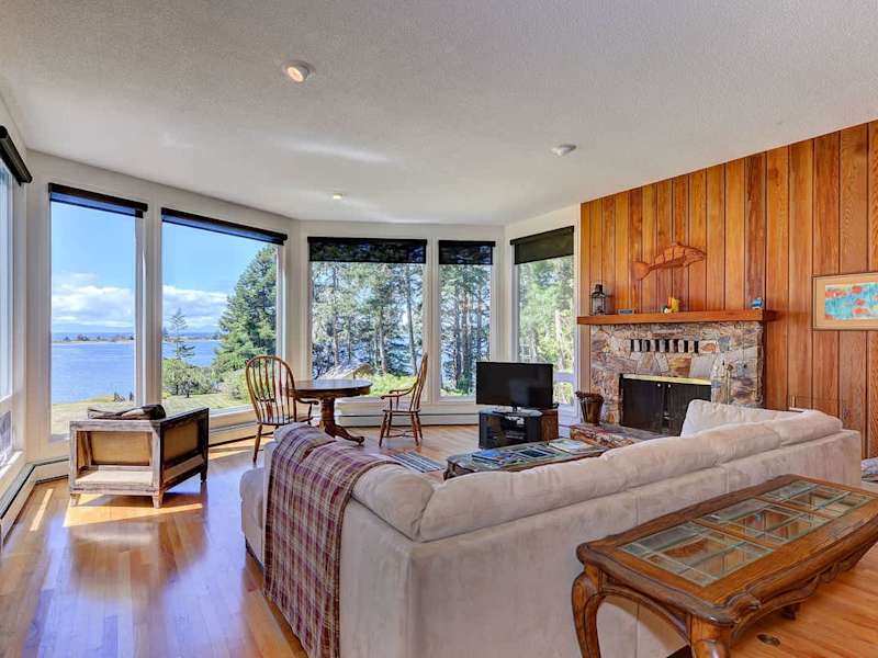 Well appointed living room with incredible views and a grand piano.
