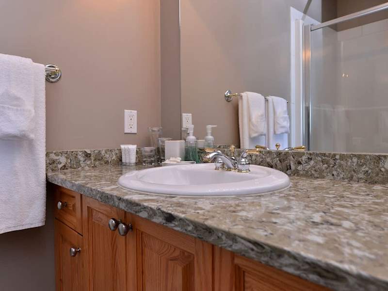 The four piece bathroom is shared by both the third and fourth bedroom. It can also be accessed by the hallway. 