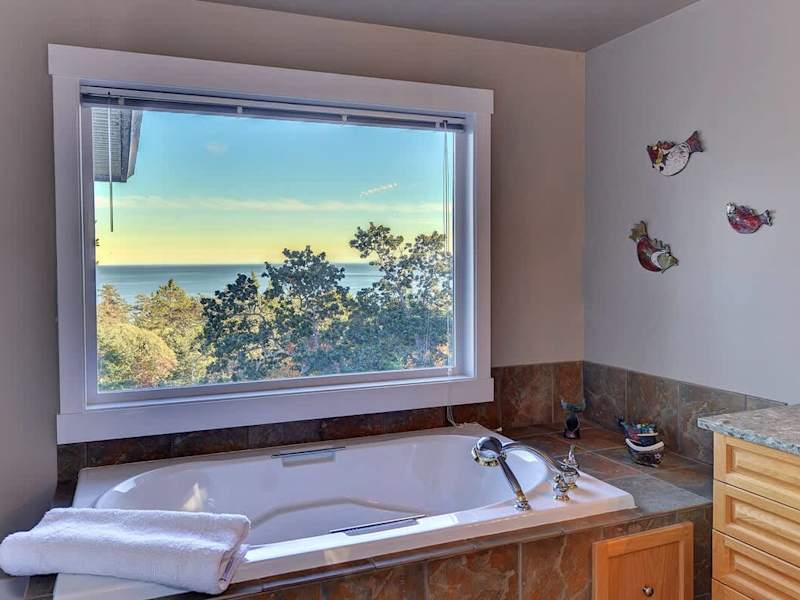 A large tub with views to soak up the view. 