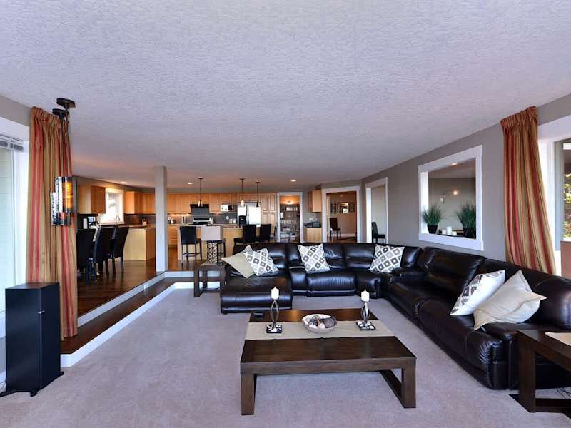 The formal living room with large sectional couch.