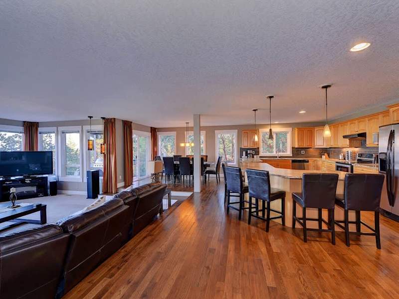 Open concept formal living room, dining area and kitchen.