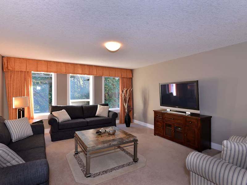 The family room, located off the front foyer is a cozy spot to read a book or enjoy some television.