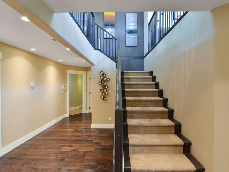 Main level staircase to the upper main level. 