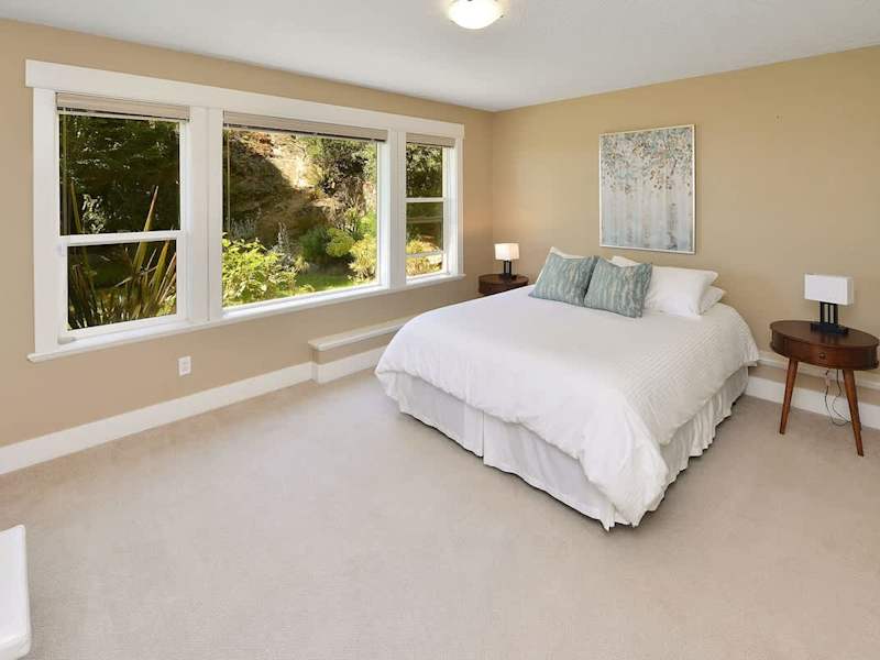 Main level 5th bedroom with Queen Bed.