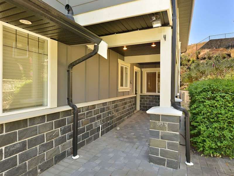 Main level suite entrance to right of house. 