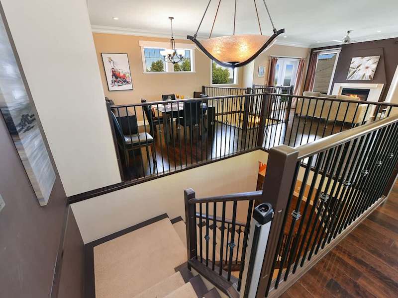 Main level staircase to the upper main level. 