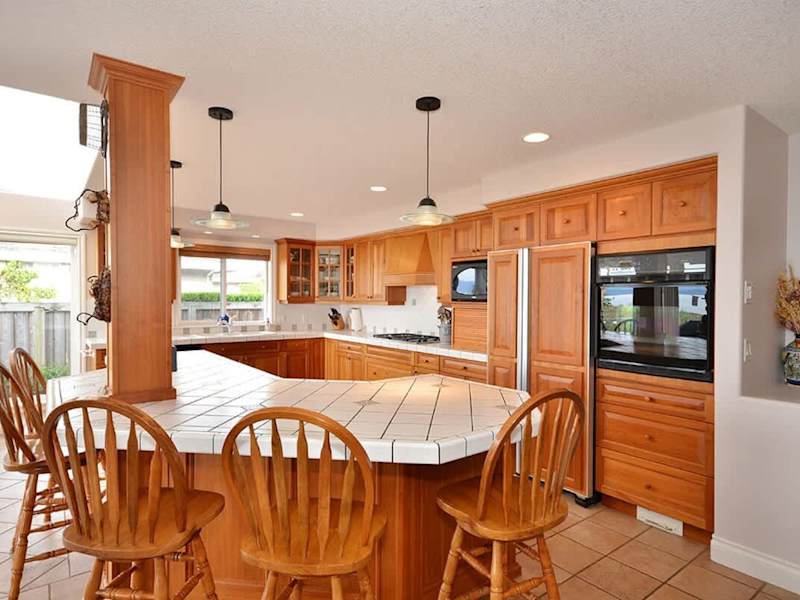A gourmet kitchen with huge island and custom cherry cabinetry.