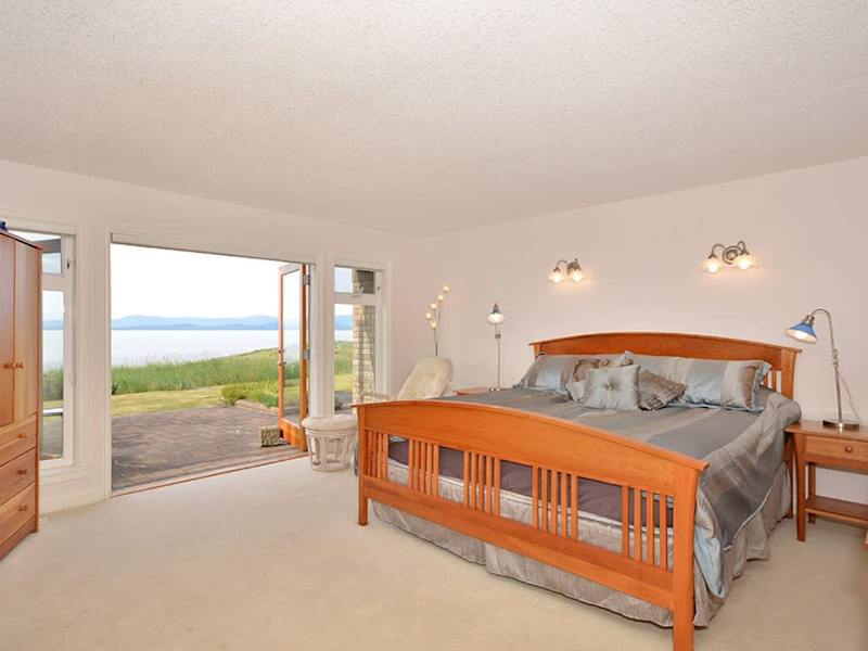 Master bedroom with king and a walk-in closet-sized bed