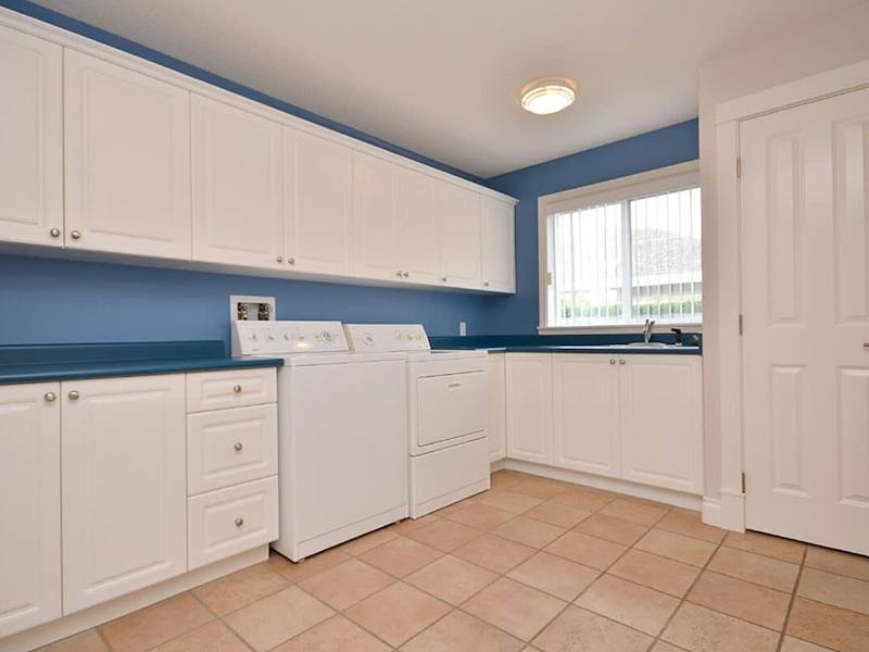 Enormous laundry room with tiled floors.