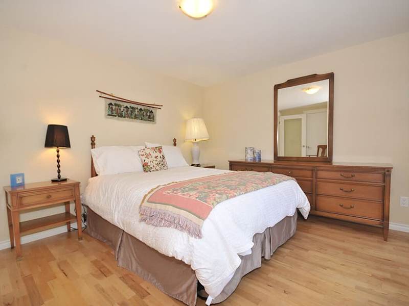 Second bedroom with queen-sized bed and with both ocean and garden views