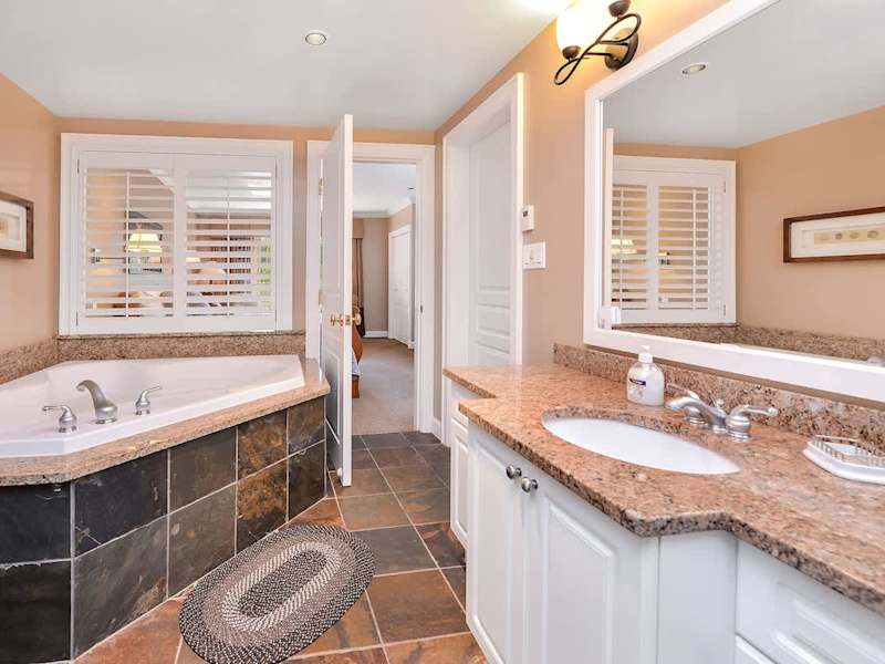 Large and spacious Master bathroom with walk in shower and soaker tub. 