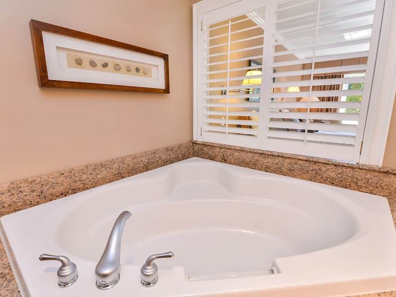 Large and spacious Master bathroom with walk in shower and soaker tub. 
