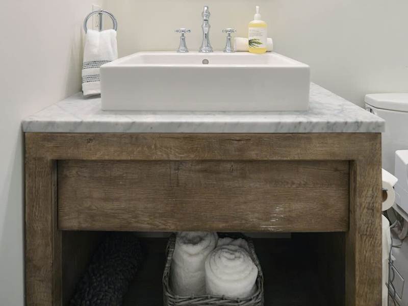 Second main level bathroom with walk in shower.