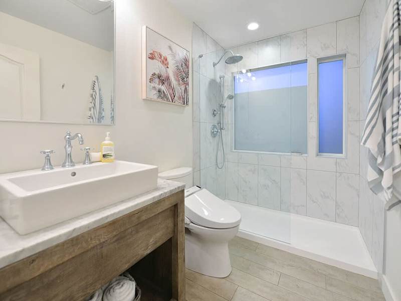 Second main level bathroom with walk in shower.