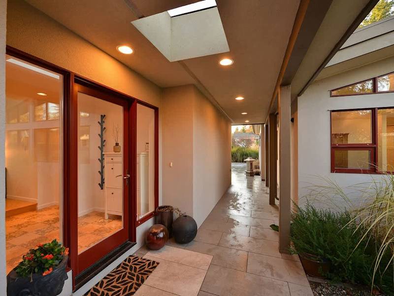 Breezeway to main entrance and office entrance.