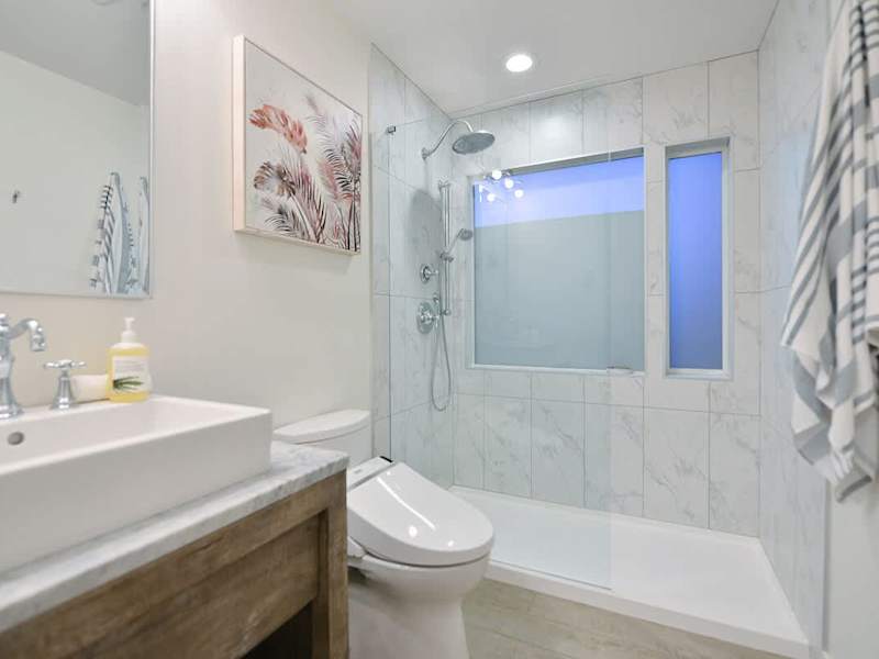 Second main level bathroom with walk in shower.