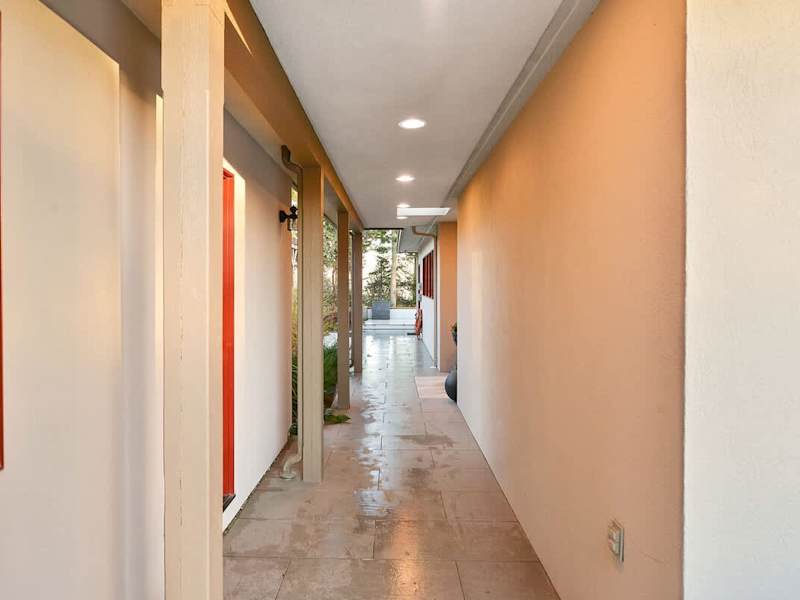 Breezeway to main entrance and office entrance.