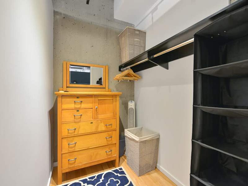 Primary bedroom walk in closet.