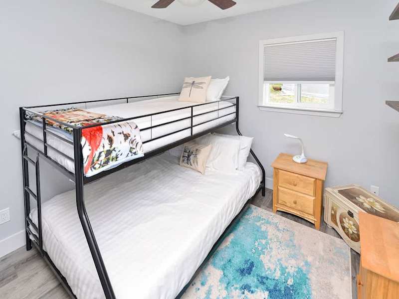 Second bedroom bunk beds with double and single up.
